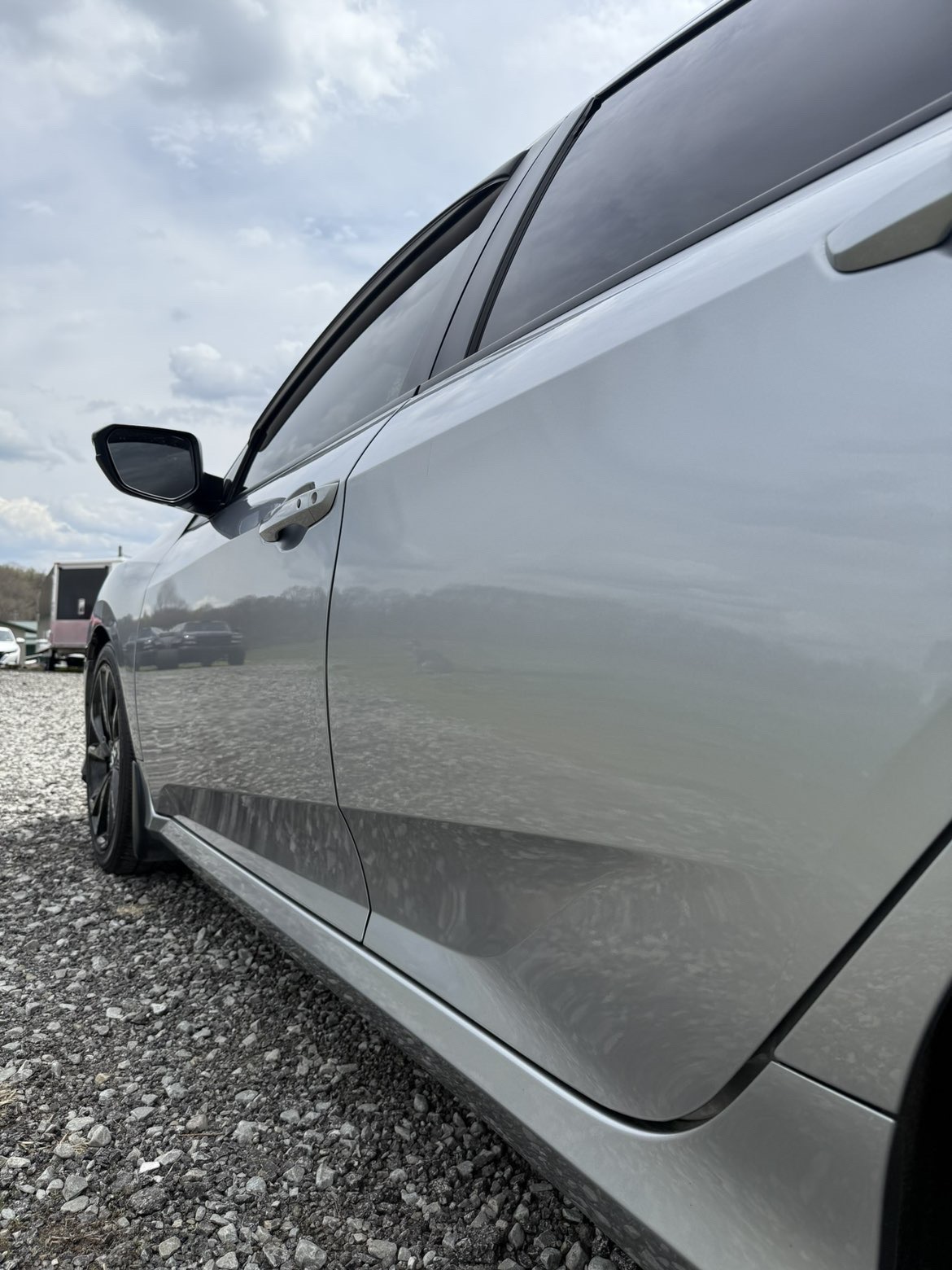 Silver Civic paint reflecting clouds